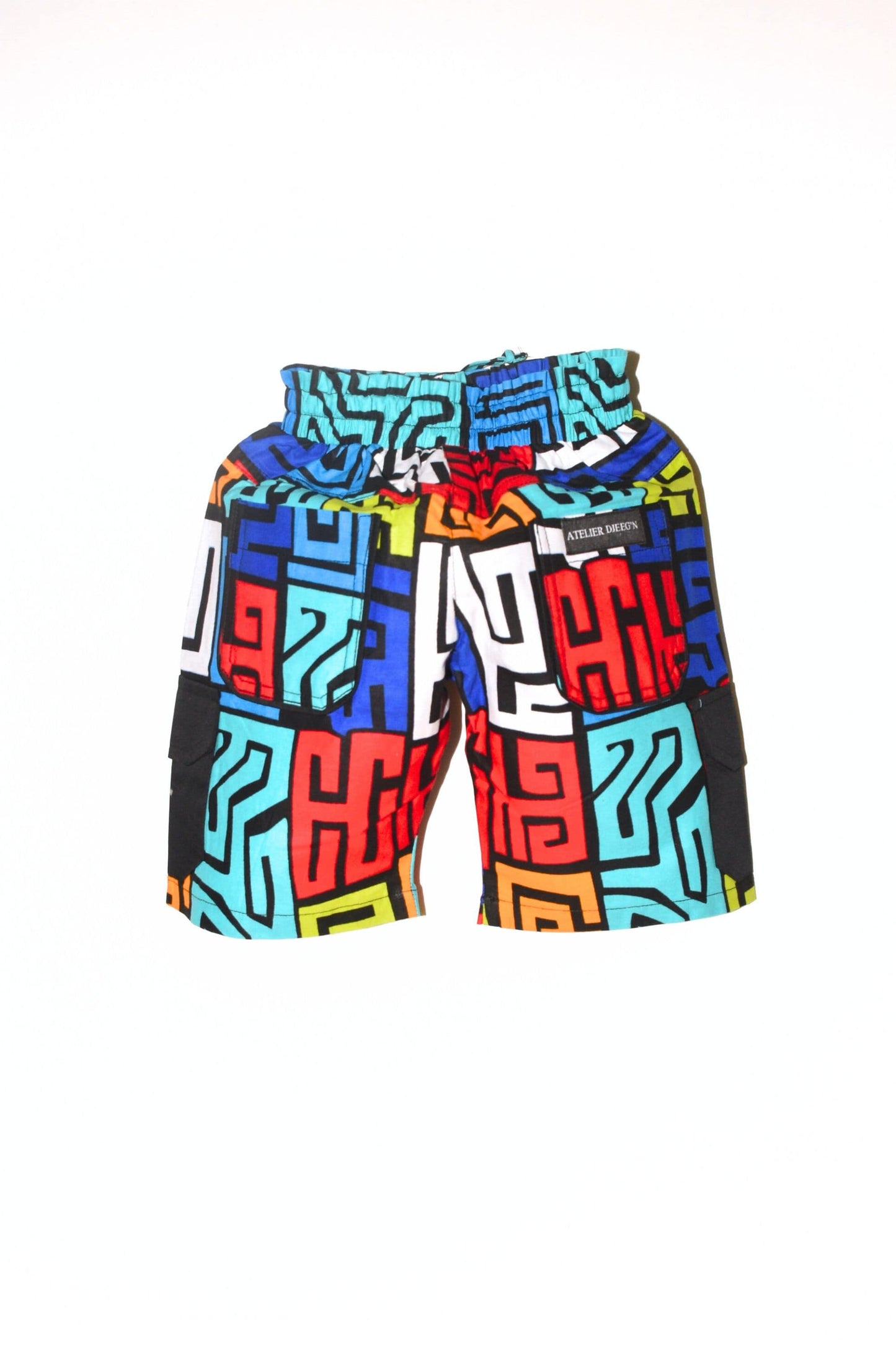 Bermuda Cargo Short In Wax Colorful Print Fabric with Black pockets on the sides by Atelier Djeeg'n