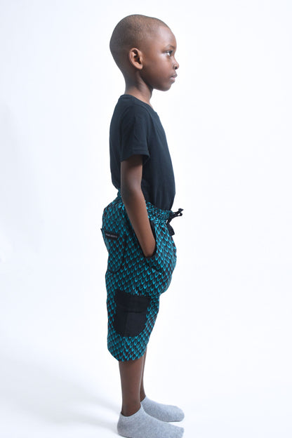 Cargo Bermuda Shorts in Vibrant African Blue Green Scales Print and black Accents for Boys 2 by Atelier Djeeg'n